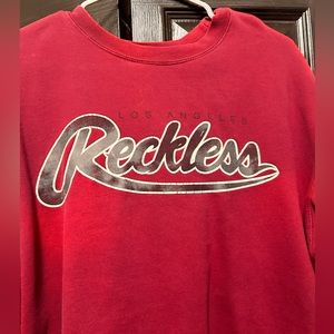 Young and reckless sweater